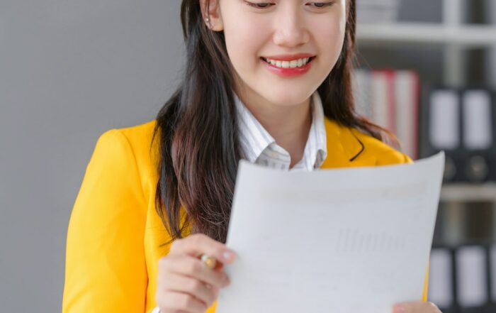 Yellow suit female asian people real estate agents and loan providers at work.