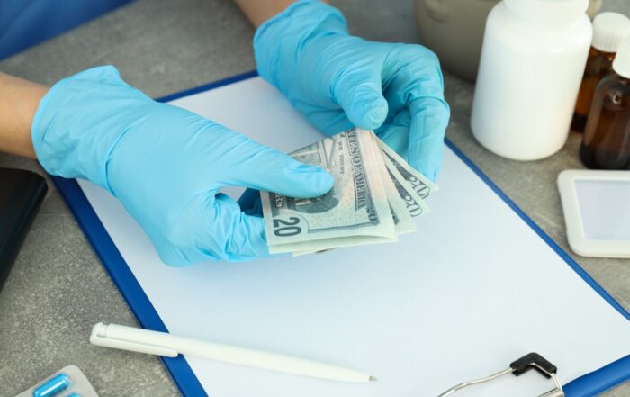 how health insurance make money